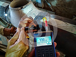 Hardness testing of alloy pipe and welding photo