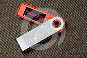 hardware Bitcoin wallet with hacked message on screen