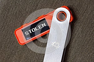 hardware Bitcoin wallet with message Stolen on screen