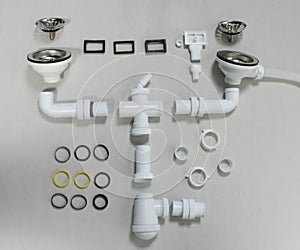 Hardware elements and tubes for a kitchen sink drain
