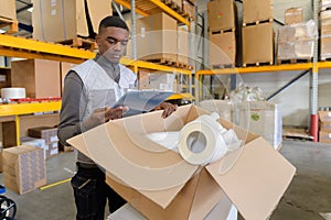 Hardware store worker checking supplies in warehouse