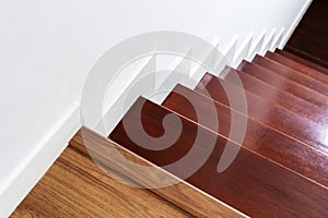 Hardwood stair steps and white wall, interior stairs material and home design