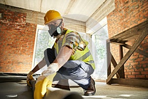 hardworking construction worker in safety helmet