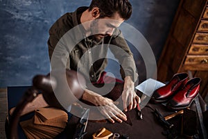 Hardworking man using craft tool