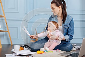 Hardworking strong mother perusing data research