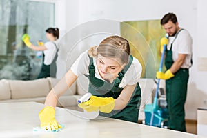 Hardworking young girl as a cleaner photo