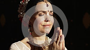 Hare Krishna Woman in namaste position