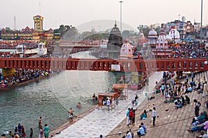 Holy ghats and temples at Haridwar, India, sacred town for Hindu religion. Pilgrims praying and bathing in the Ganges River.