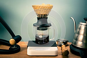 Hario V60 Immersion Dripper preparing coffee on the blurred background