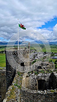 Harlech Castle, Wales, UK with Welsh Dragon Flag