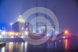 Harlingen, Netherlands - January 09, 2020. Port of Harlingen in fog at night