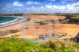 Harlyn Bay beach North Cornwall England UK near Padstow and Newquay in colourful HDR with cloudscape