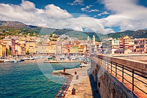 Ð¡harm of the ancient cities of Europe. Adorable summer cityscape of Bastia port with twin-towered Church
