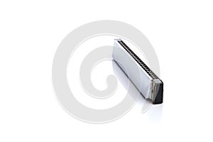 Harmonica, also French harp, blues harp, and mouth organ, isolated on white background.