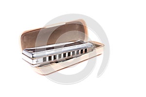 Harmonica in box isolated on white