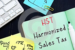 Harmonized Sales Tax â€“ HST  sign on the piece of paper