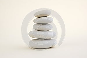 Harmony and balance, cairn, poise stones, rock zen sculpture, three white pebbles