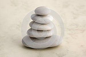 Harmony and balance, cairn, poise stones, rock zen sculpture, three white pebbles