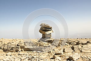 Harmony and balance, poise stones against the blue sky in the mountains, rock zen sculpture