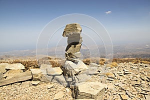 Harmony and balance, poise stones against the blue sky in the mountains, rock zen sculpture