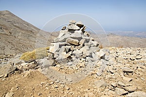 Harmony and balance, poise stones against the blue sky in the mountains, rock zen sculpture