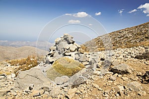 Harmony and balance, poise stones against the blue sky in the mountains, rock zen sculpture