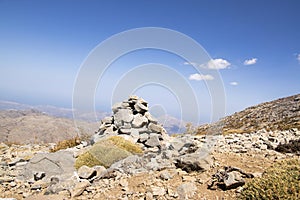 Harmony and balance, poise stones against the blue sky in the mountains, rock zen sculpture