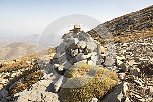 Harmony and balance, poise stones against the blue sky in the mountains, rock zen sculpture