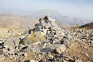 Harmony and balance, poise stones against the blue sky in the mountains, rock zen sculpture