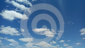 The harmony of the colors of the bright white clouds and the clear blue sky in the summer