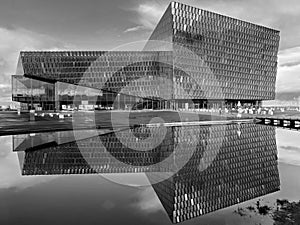 Harpa Operahouse in Reykjavik mirroring in water.