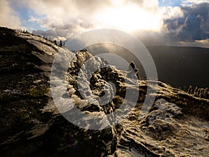 Harsh landscape on a mountain range of Jeseniky mountains with stunted trees covered with rime in late autumn