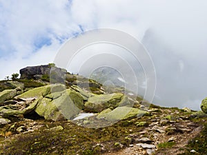 Harsh mountain landscape. Fog in the rocks