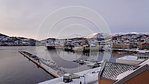 Harstad city harbour at sunrise in winter in Northern Norway