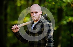 Harvest firewood. Hike vacation. Hike in forest. Forest care. Determination of human spirit. Man checkered shirt use axe