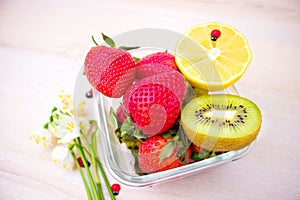 Harvest juicy fruit and berries. lemon, strawberry, kiwi