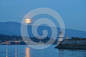 Harvest Moon and brockton point Lighthouse photo