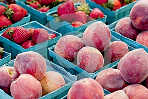 Harvest of peaches and strawberries at farmers market