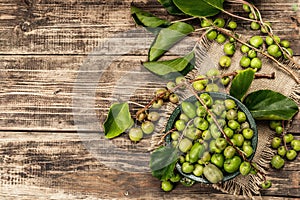 Harvest of ripe Actinidia arguta kiwi in a ceramic bowl