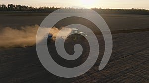 Harvest spring sunset combine field landscape Ukraine aerial green