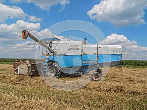 harvest time, combines the field to gather the wheat