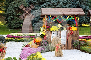 Harvest vegetables on fair trade in a wooden pavilion. Seasonal traditional ukrainian exhibition of farmers achievements.