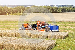 Harvester on a agricultural trial field