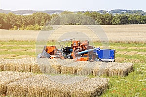 Harvester on a agricultural trial field photo