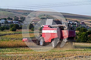 Harvester combine autumn graine wheat farmer worker plantation technology green field