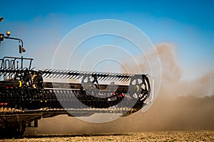 Harvester combine during autumn soybean harvest in Illinois