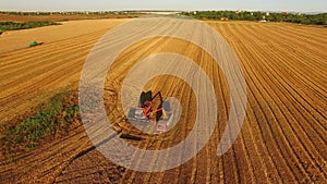 Harvester in a golden field