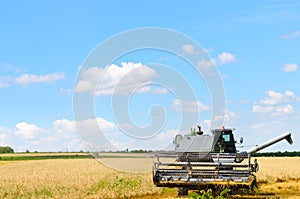 Harvester machine working in field