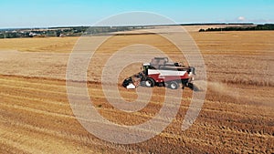 Harvester-thresher is harvesting and processing rye