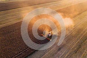 Harvesting oilseed rape in autumn field